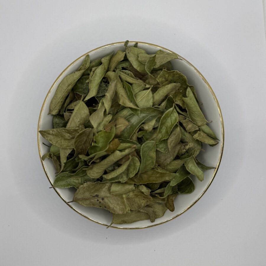 Bowl of fresh-looking dehydrated curry leaves
