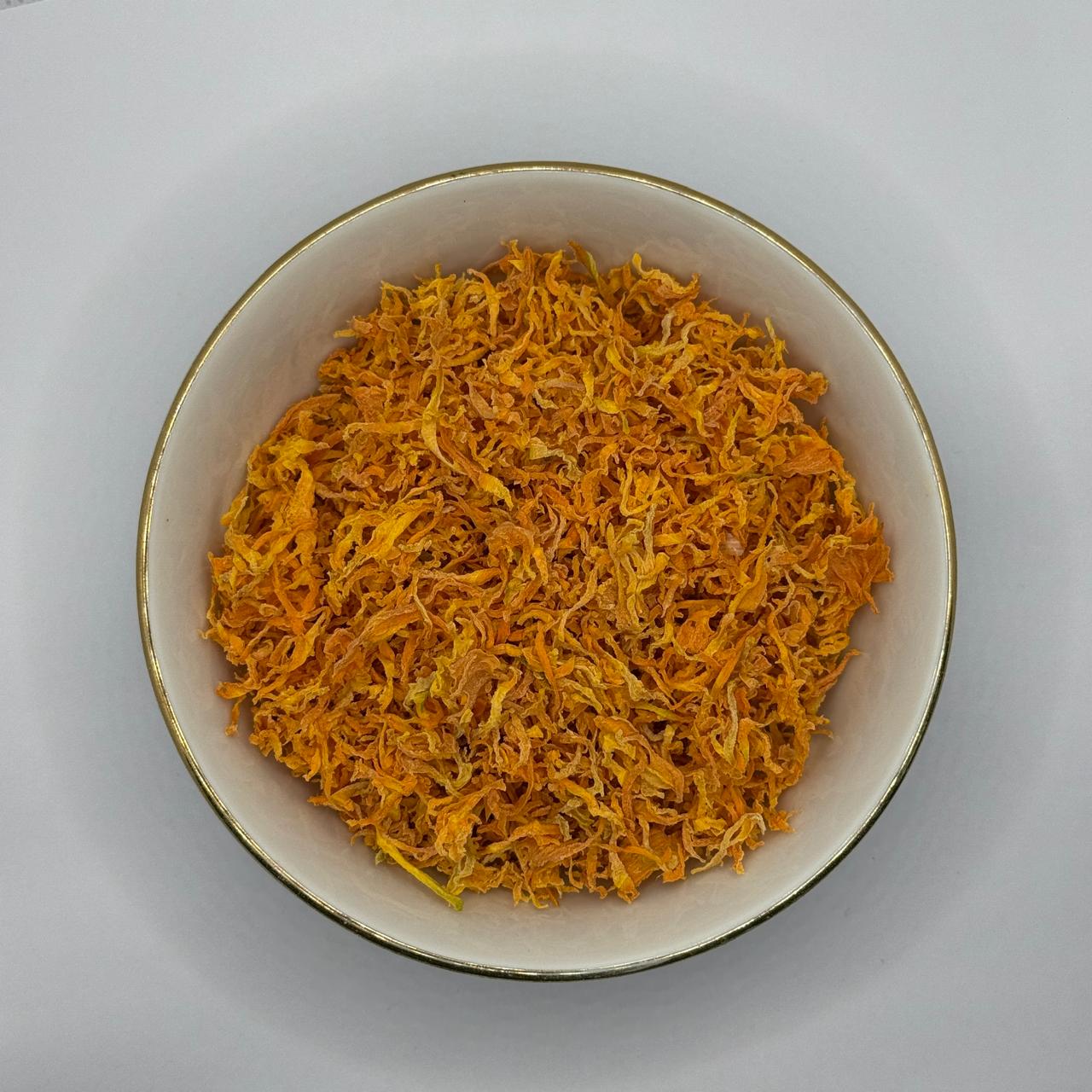 Bowl of small dehydrated carrot pieces