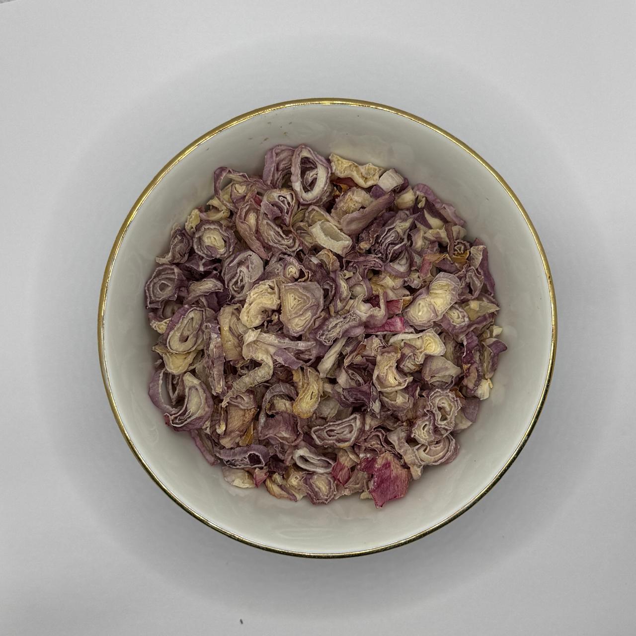 Bowl of dehydrated red onion pieces